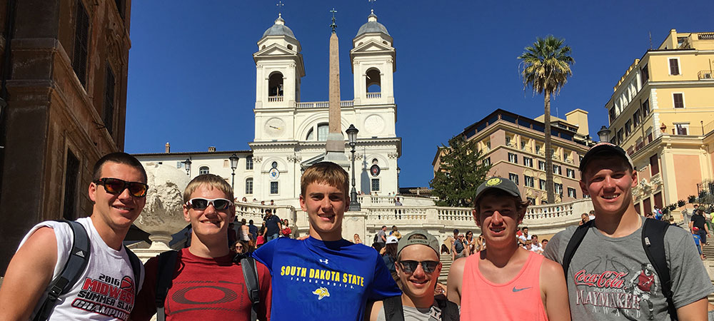 Explorica Students with a mountain in the background