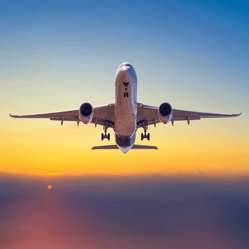 Airplane Takeoff into Sunset